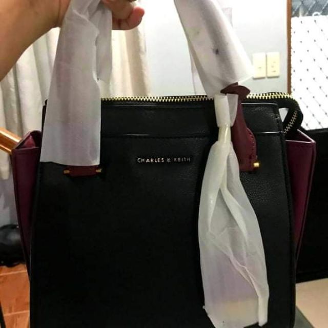 top handle trapeze bag