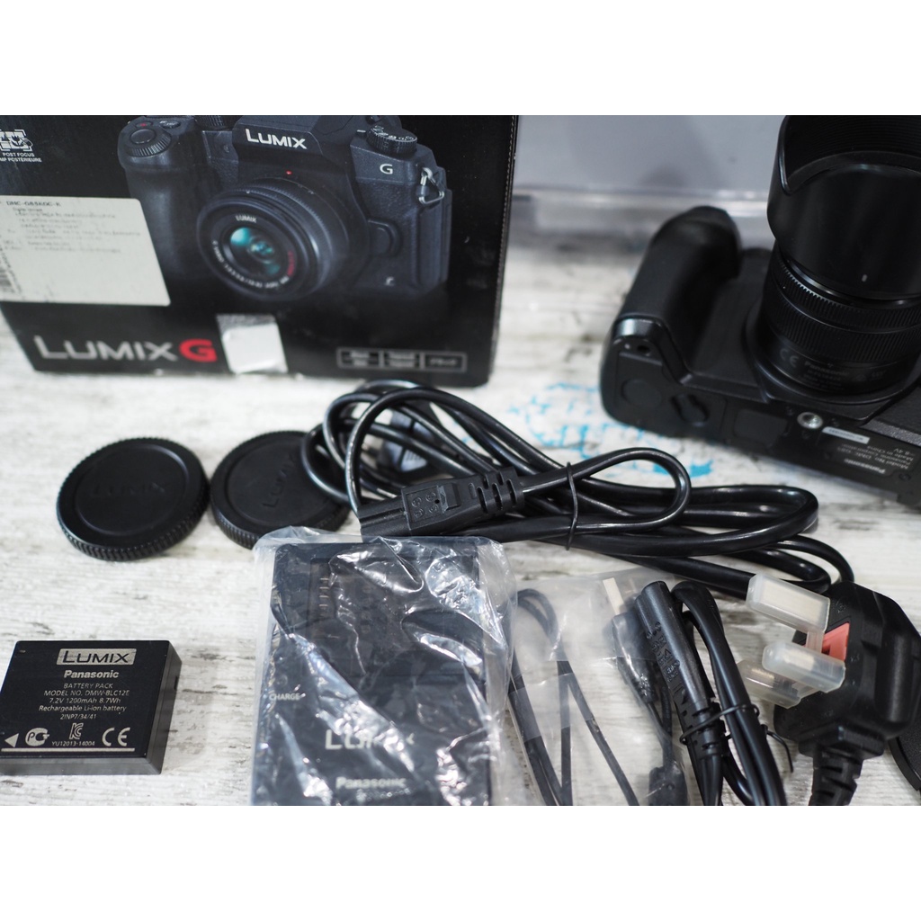 Panasonic G85 + 14-42 mid condition, no heavy marks, works well, thin rubber handles, starting to sw #5
