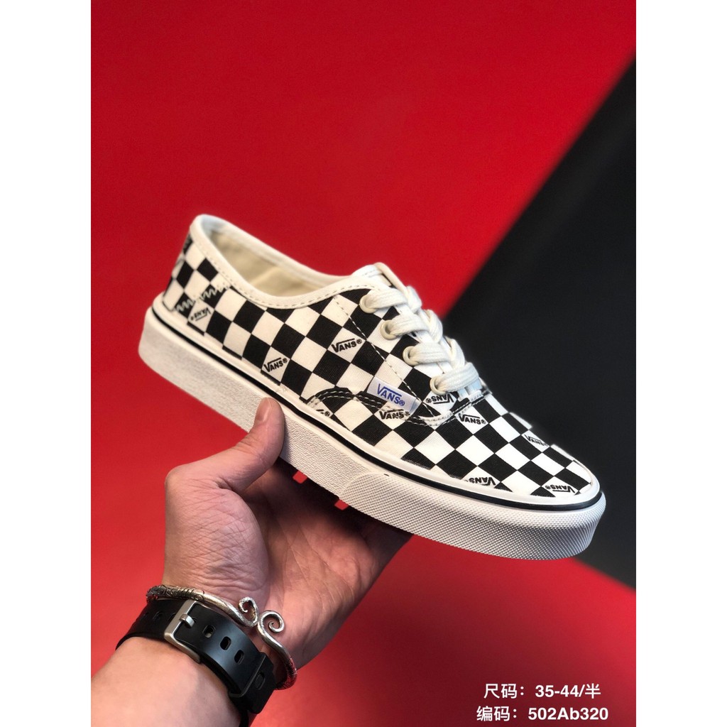 black and grey checkerboard vans lace up