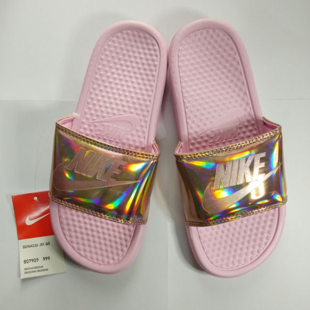 pink and gold nike slides