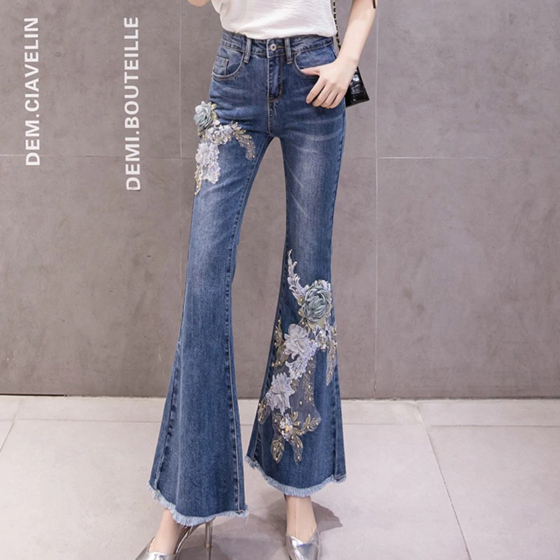 jeans with flames at the bottom