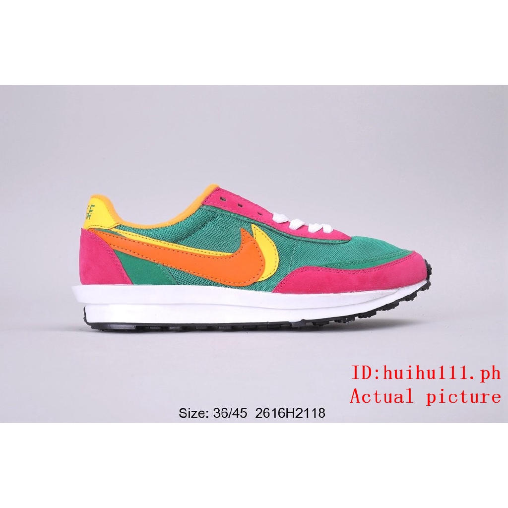 pink green nike shoes