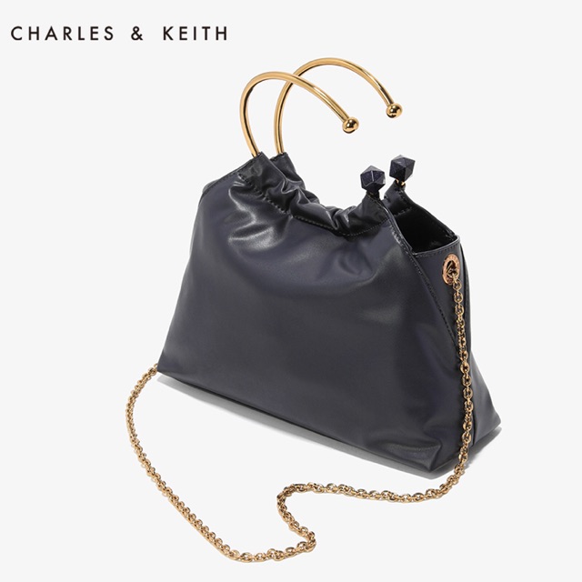charles and keith circular handle clutch