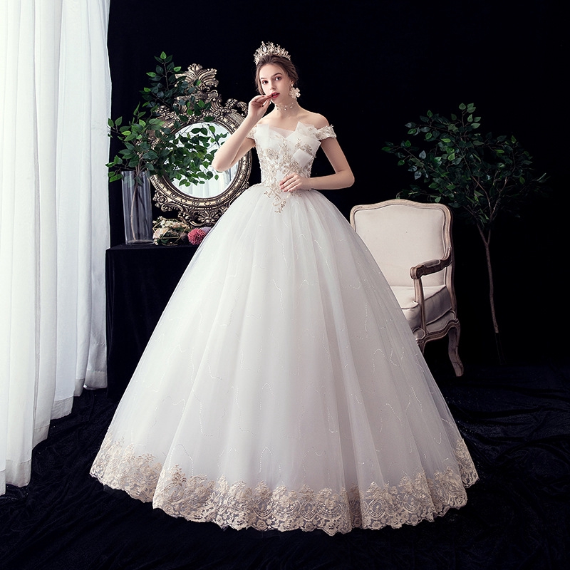 champagne off the shoulder wedding dress