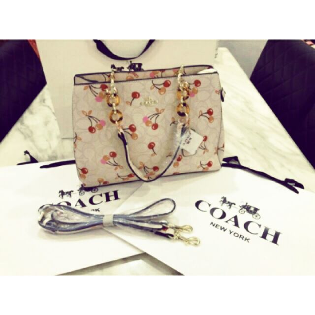 cherry coach purse