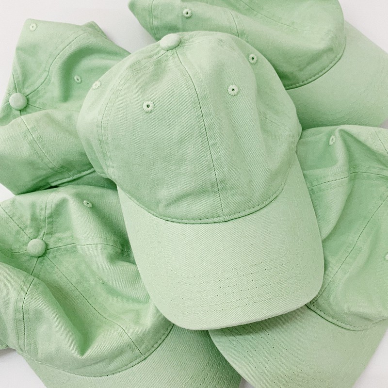 green baseball cap