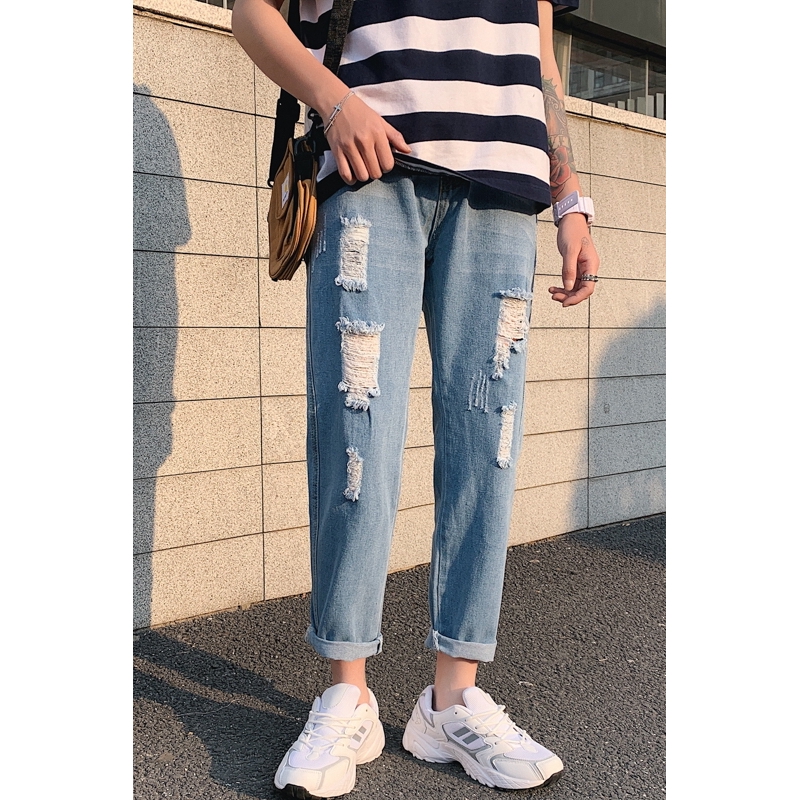 light blue jeans with holes