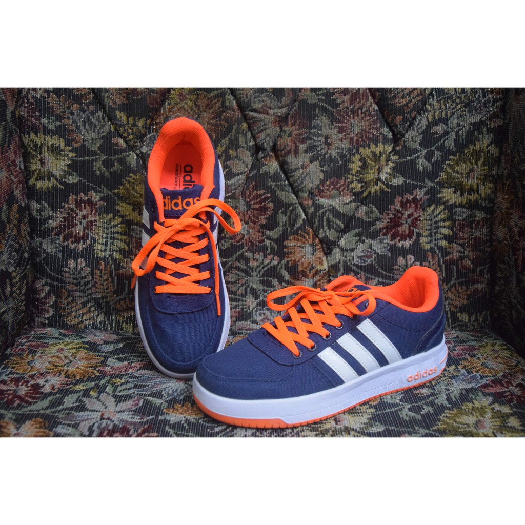 navy blue and orange adidas shoes