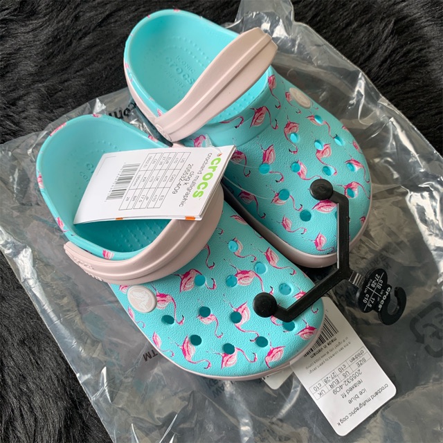 blue crocs with flamingos