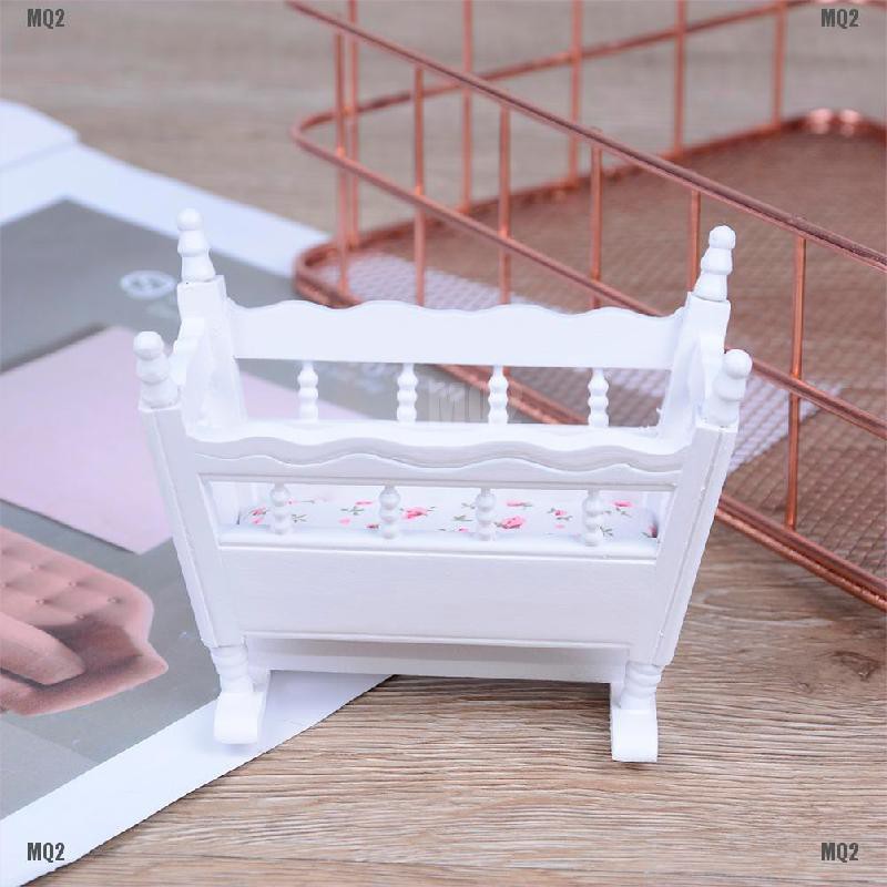 white and wood nursery furniture