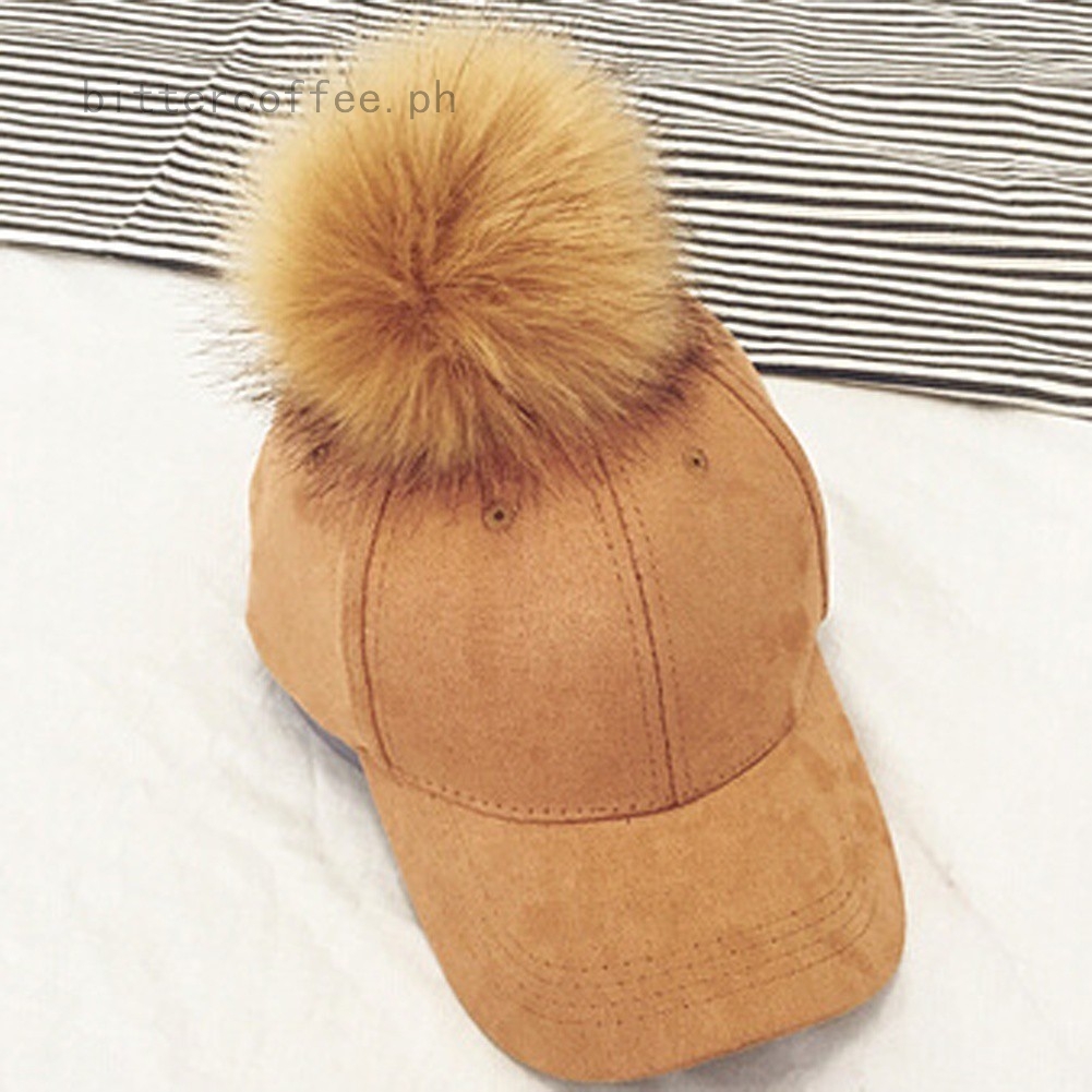baseball cap with fur pom pom