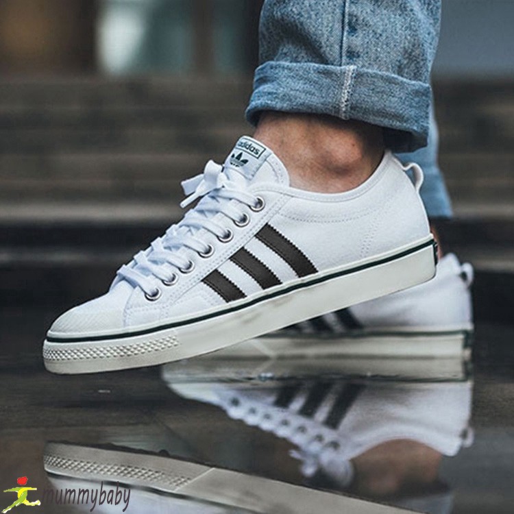white adidas canvas trainers