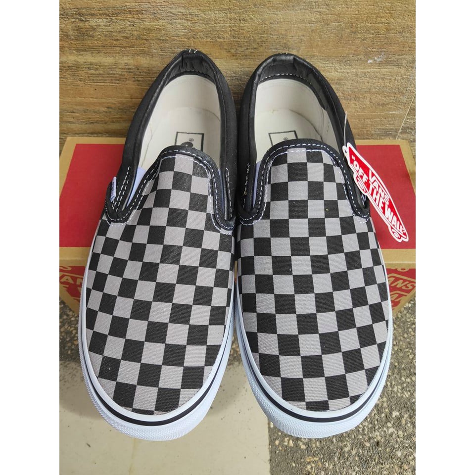 gray and black slip on vans