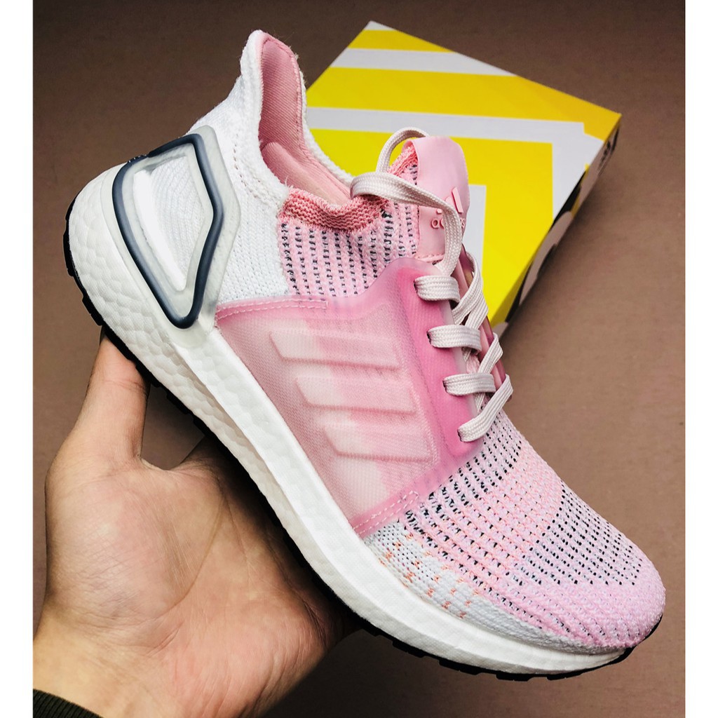 white and pink running shoes