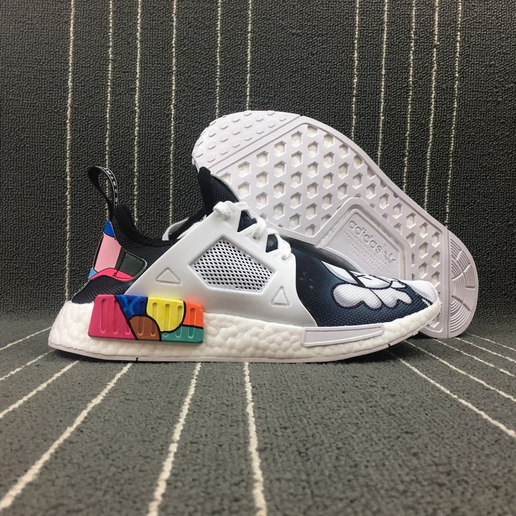 nmd r1 x kaws