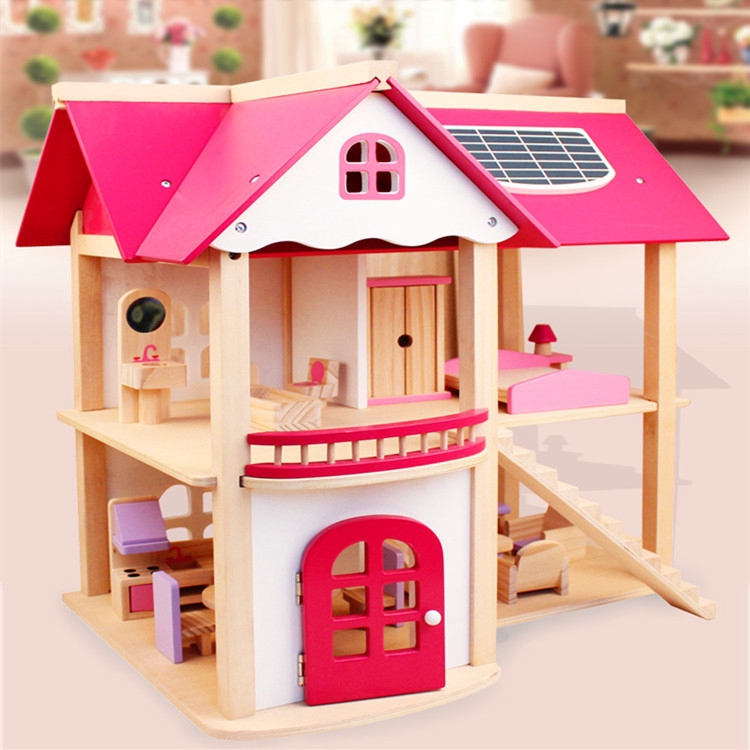 pink wooden dolls house