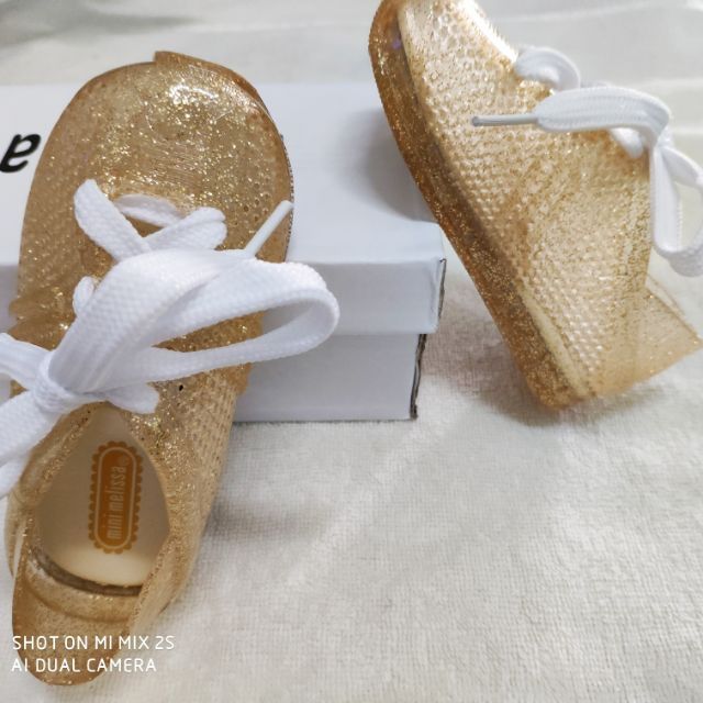 gold jelly shoes