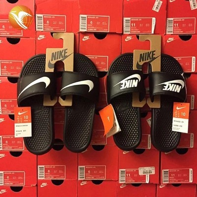 white and black nike slippers