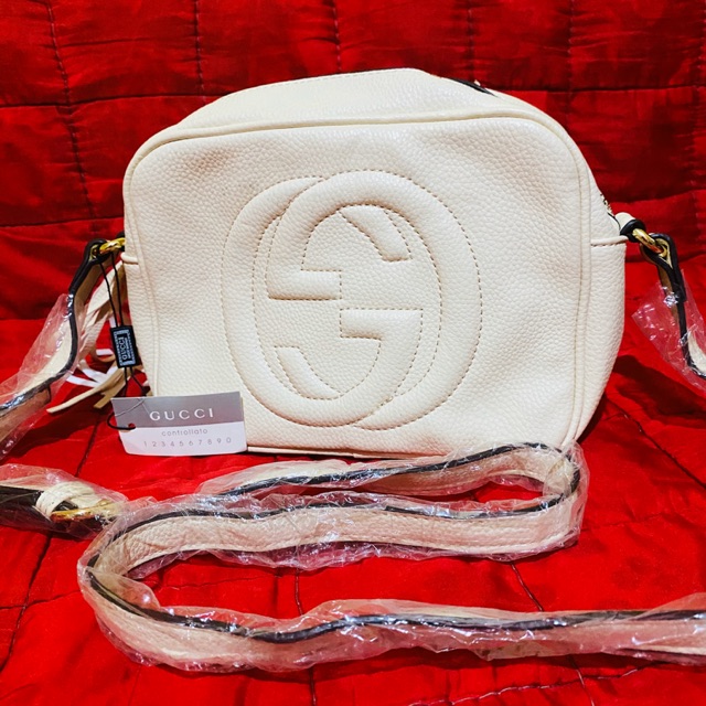 white gucci sling bag