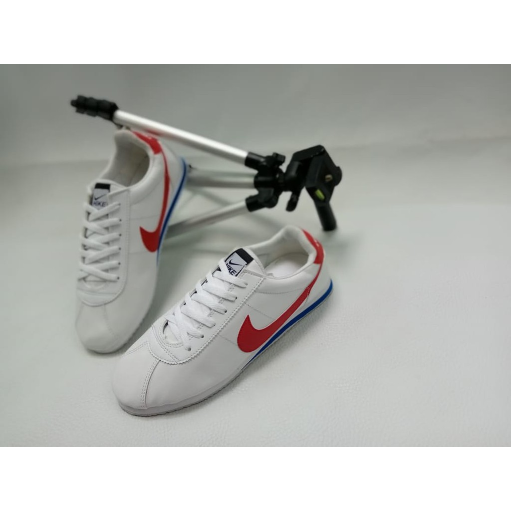 red and white gym shoes