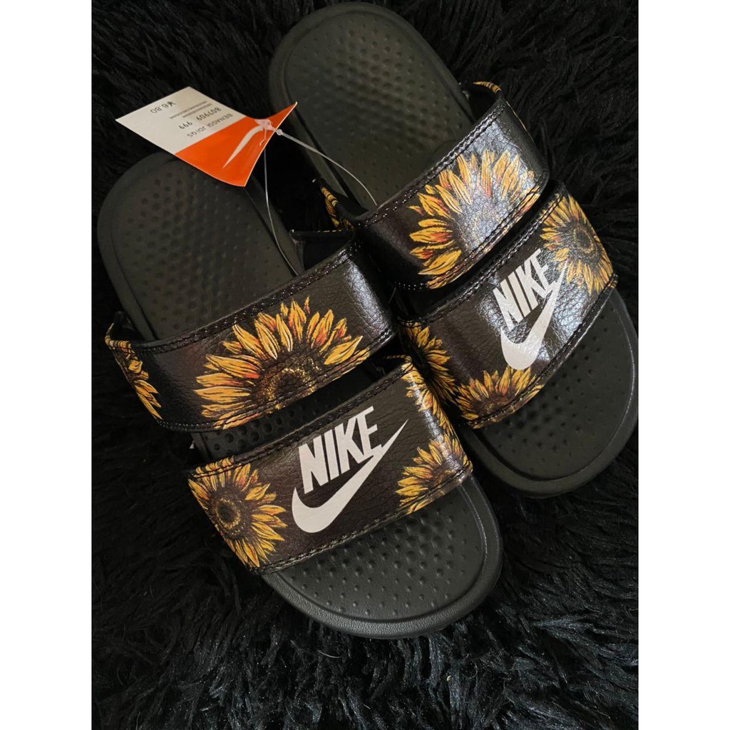 white sunflower nike slides