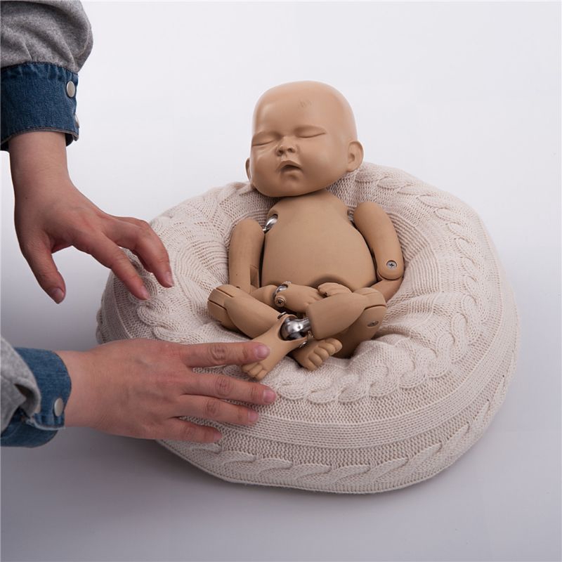newborn baby posing beanbag