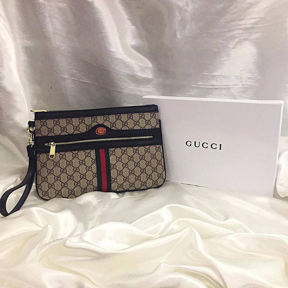 ophidia large gg supreme pouch clutch bag