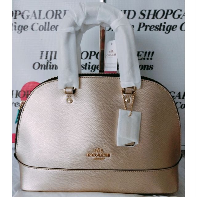 coach alma mini