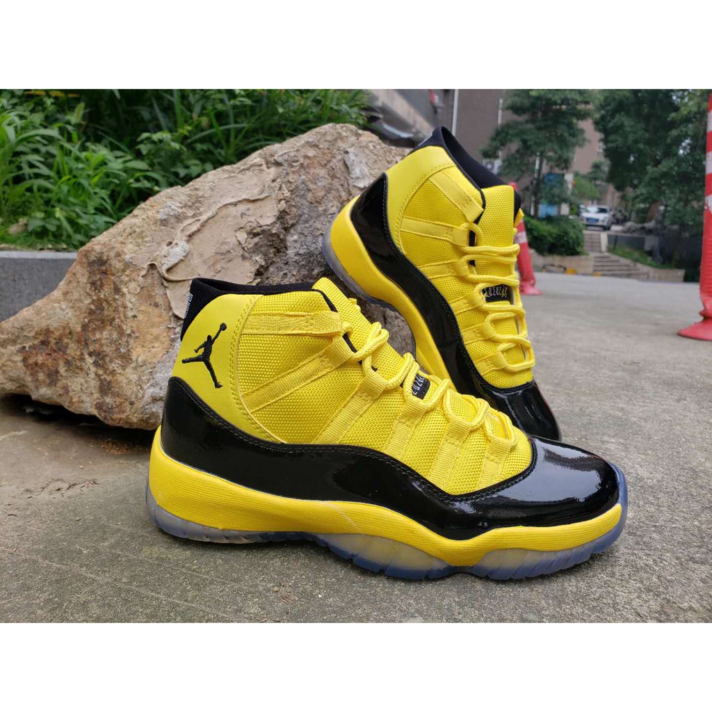 yellow and black jordan 11