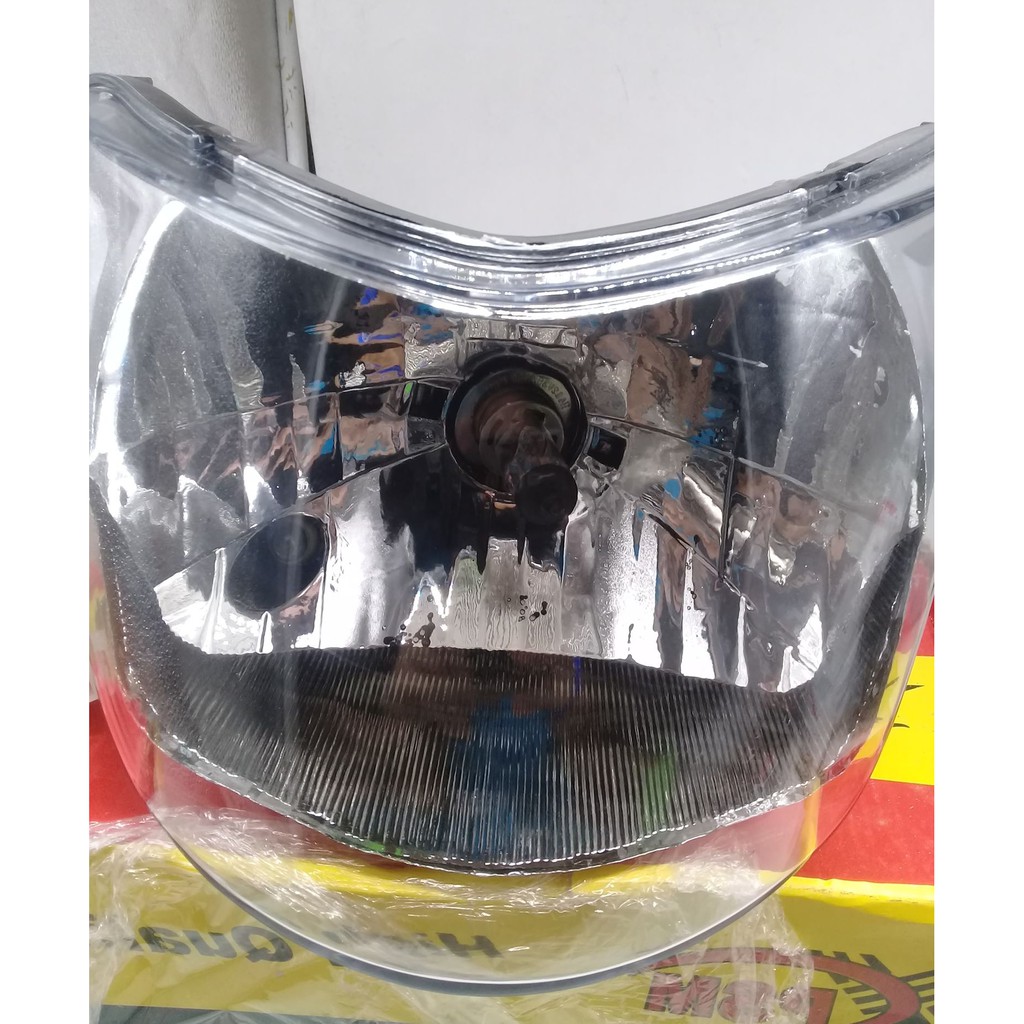 ct 100 headlight cover