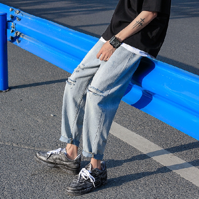 light colored distressed jeans