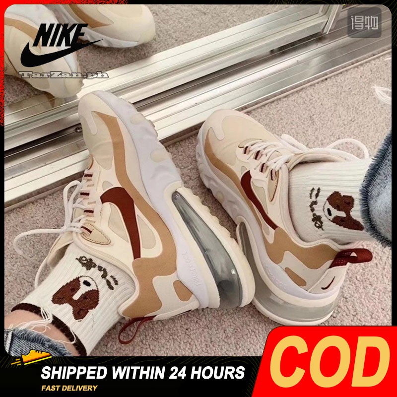 beige nike running shoes