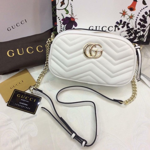 white gucci sling bag