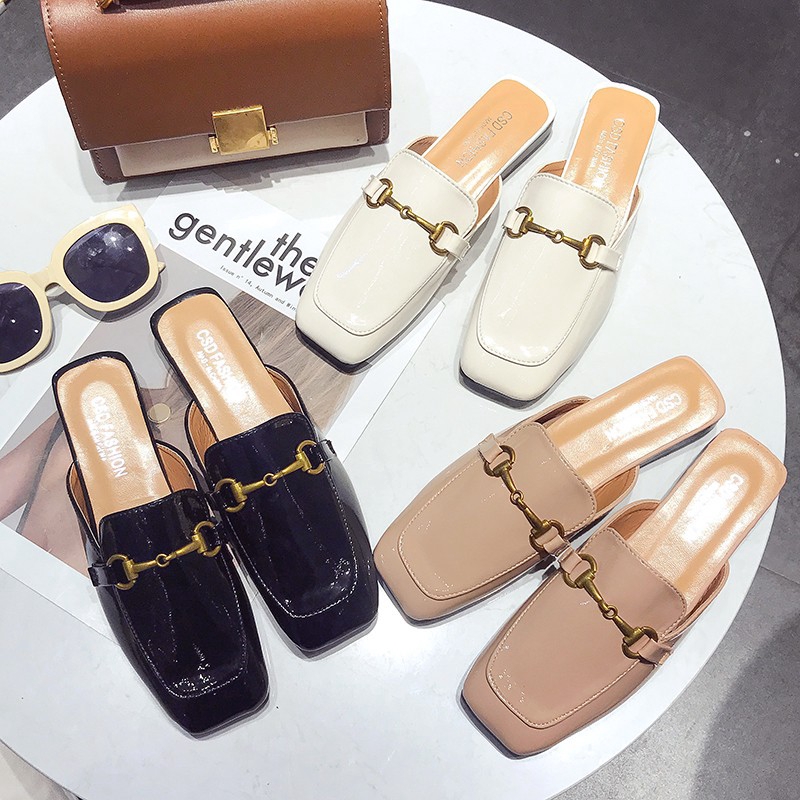 beige shoes with black toe