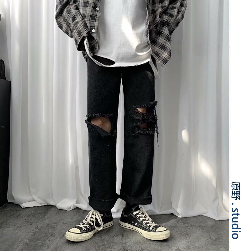 black jeans with big knee holes