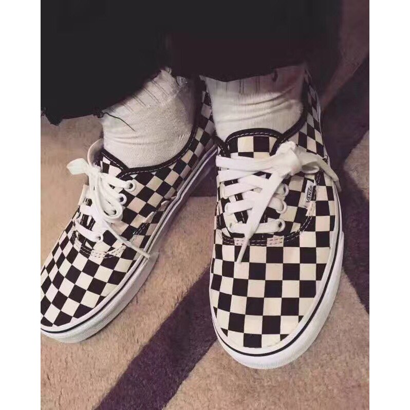 black vans with checkered laces