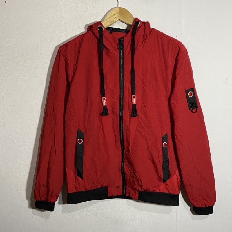 red zip up windbreaker