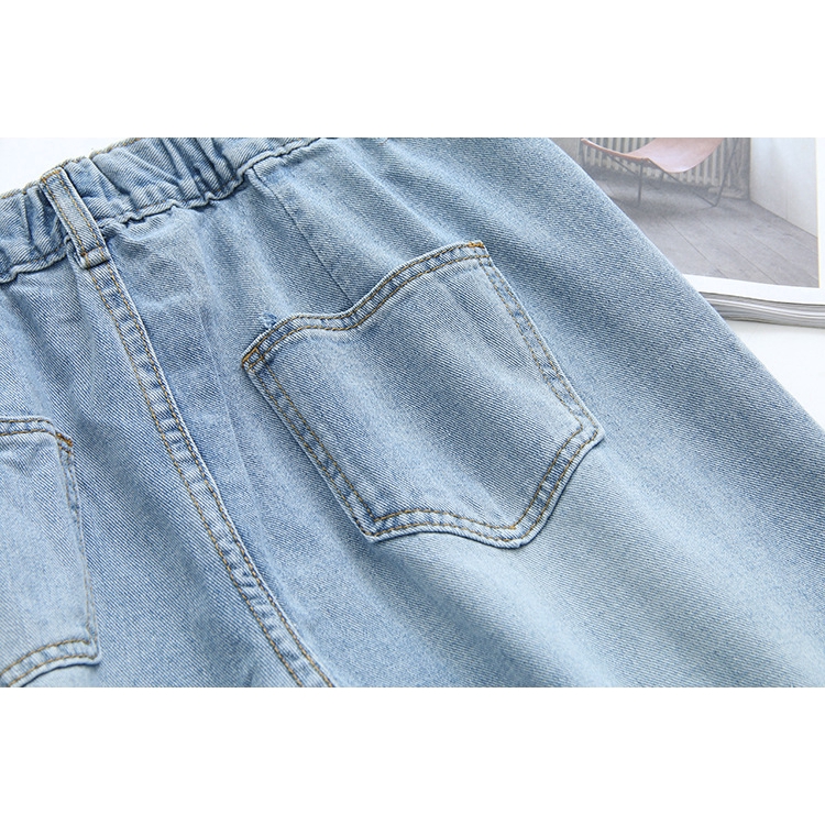 light blue jeans with holes