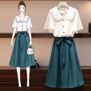 blue long skirt and white top