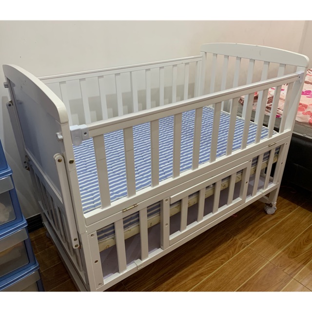 co sleeper crib attached to bed
