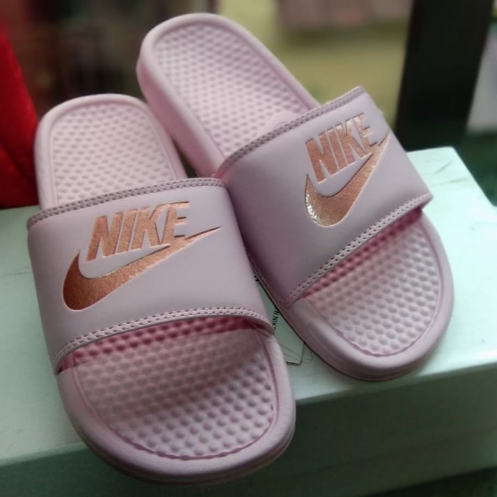 nike rose gold slippers