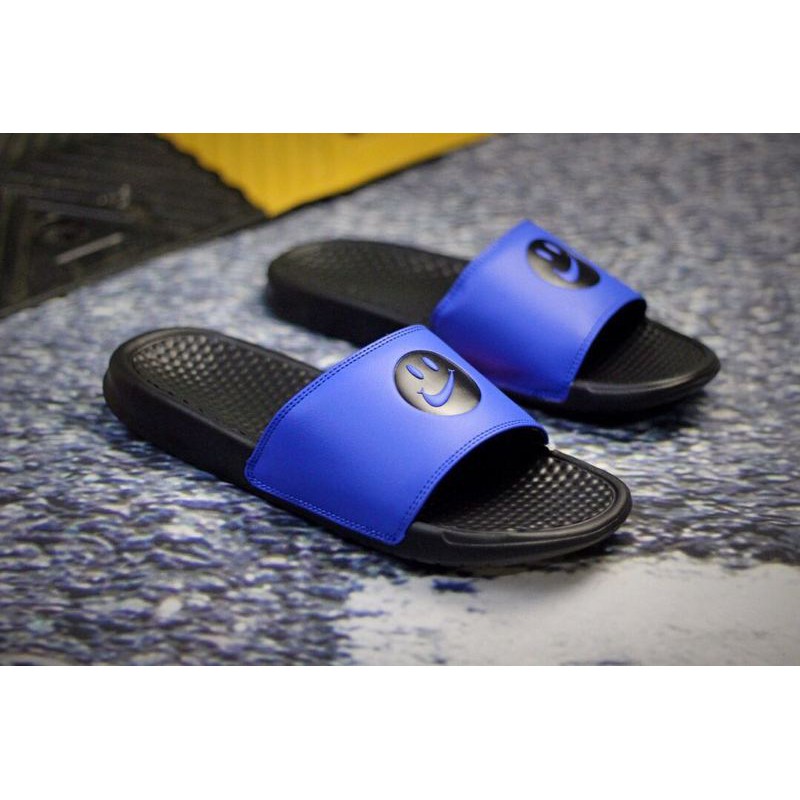 nike slides with smiley face