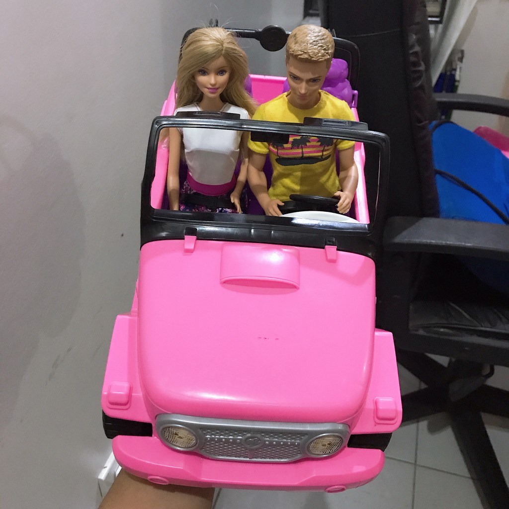 barbie and ken dolls with jeep