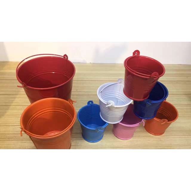 small red plastic buckets