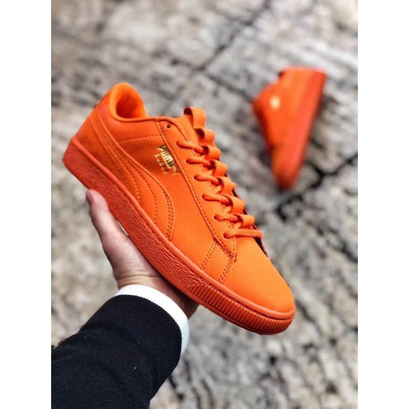 puma orange and black shoes