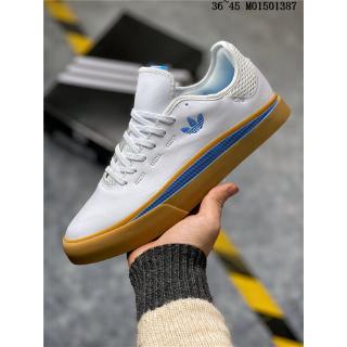 white and blue adidas samba