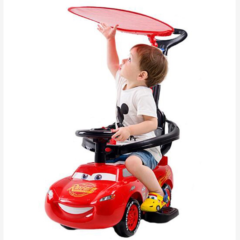 baby riding a car