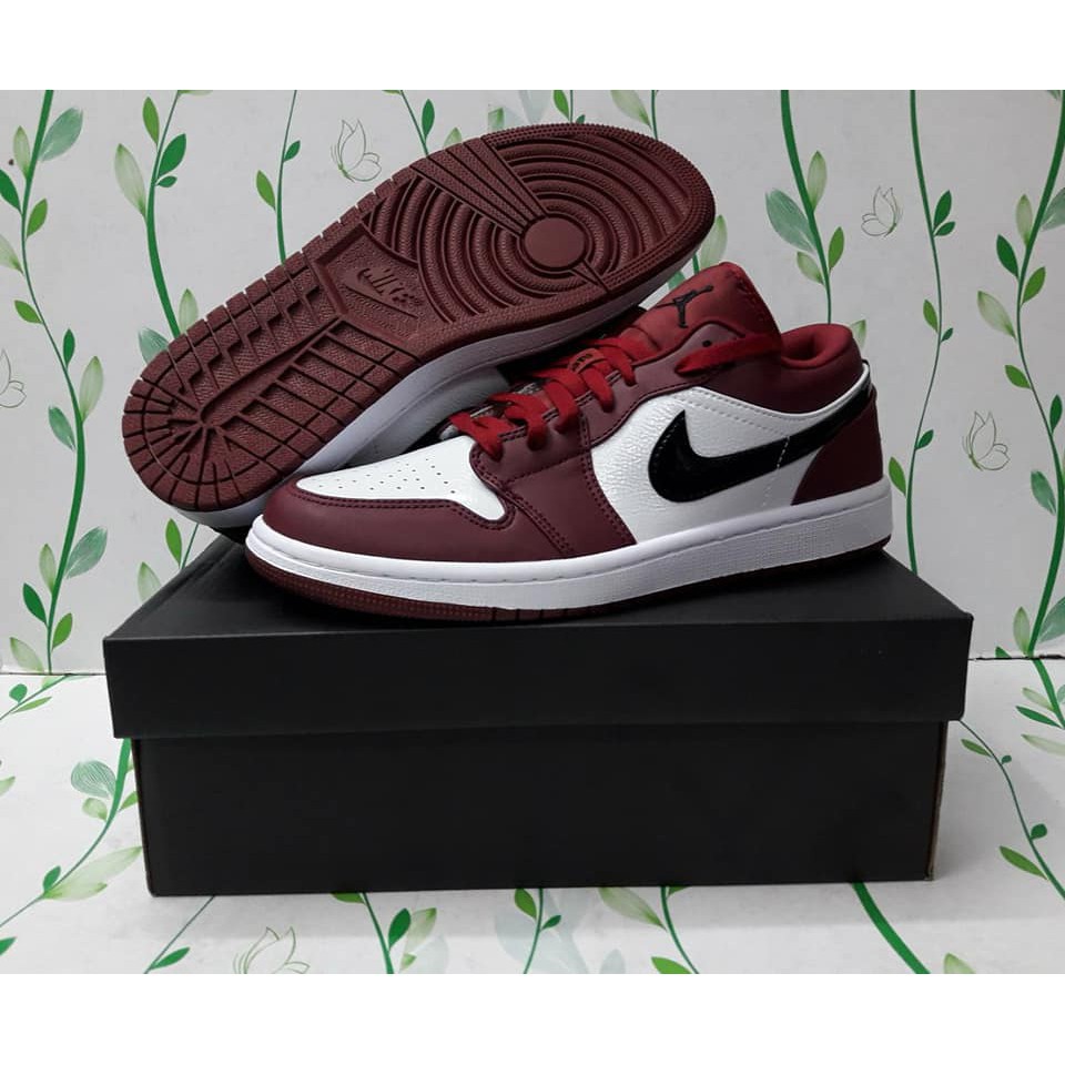 maroon and white tennis shoes