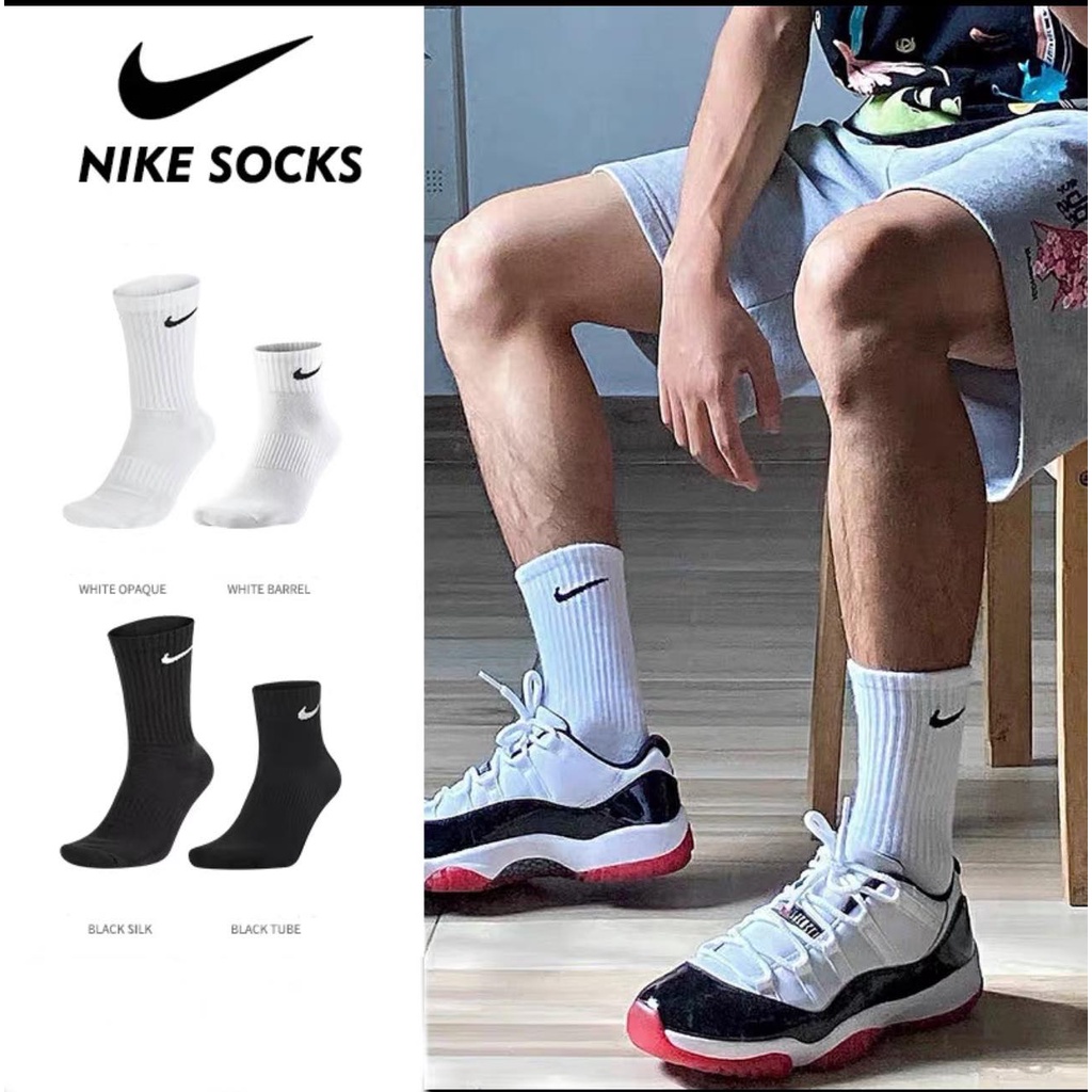 white basketball shoes with black socks