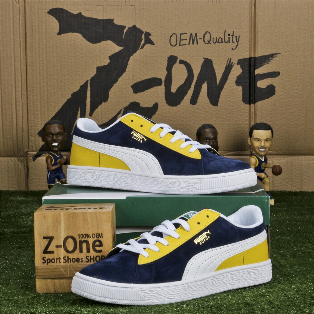 blue and yellow puma shoes